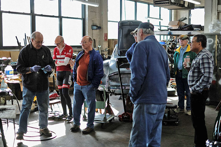 Bruce Phillips explains a finer point of Healey repair for the Capital Area Austin-Healey Club.